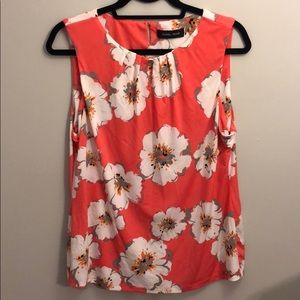 Coral sleeveless floral blouse